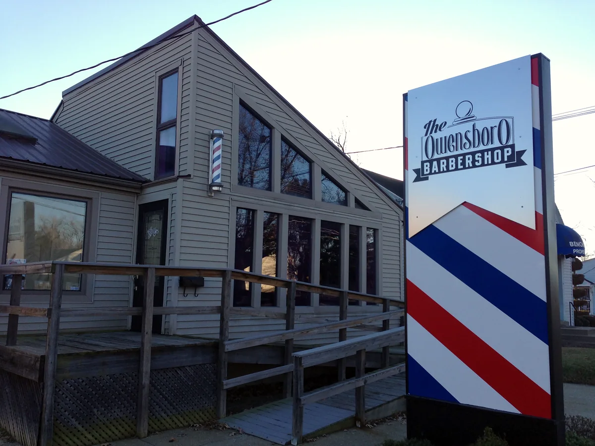 The Owensboro Barbershop on East 18th Street, with its red, white and blue barber-pole sign